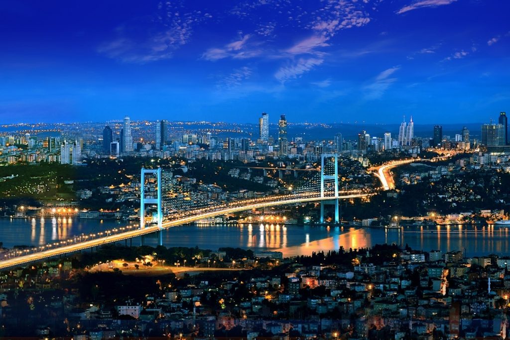 Night view of the Bosphorus Bridge and illuminated city skyline in Istanbul